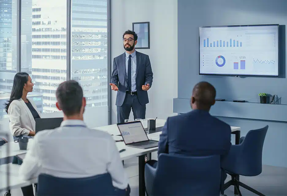 Business professional sharing AI simplified data in a meeting